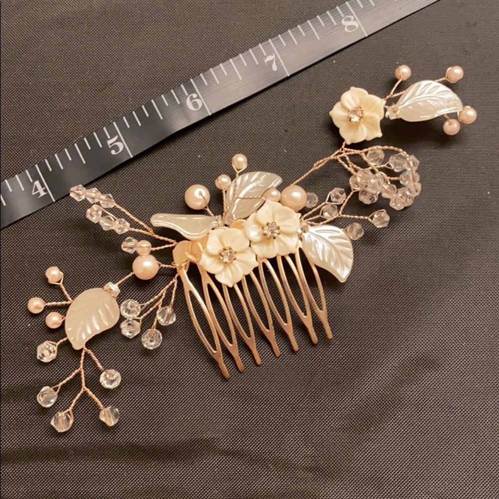 White flowers on gold hair comb